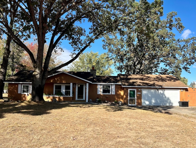 single story home featuring a garage