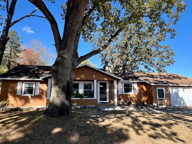 single story home featuring a garage