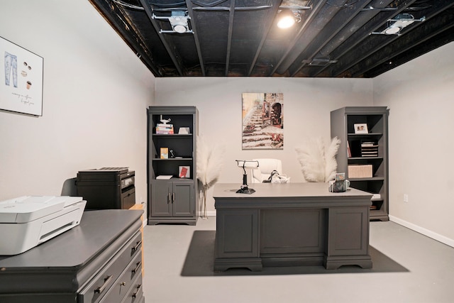 office area featuring concrete flooring