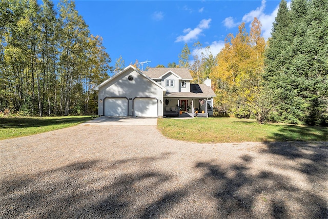 view of front of home featuring a garage and a front lawn