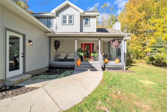 view of front of home with a front lawn and covered porch