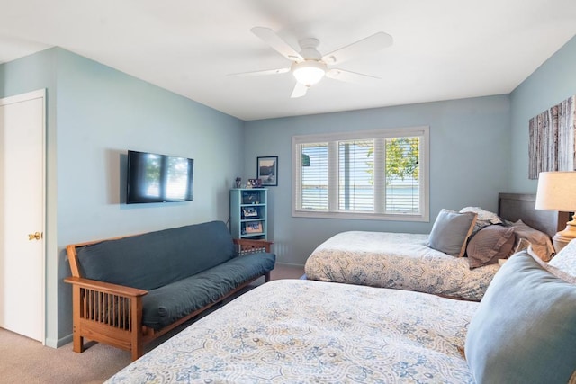 bedroom featuring ceiling fan and carpet floors