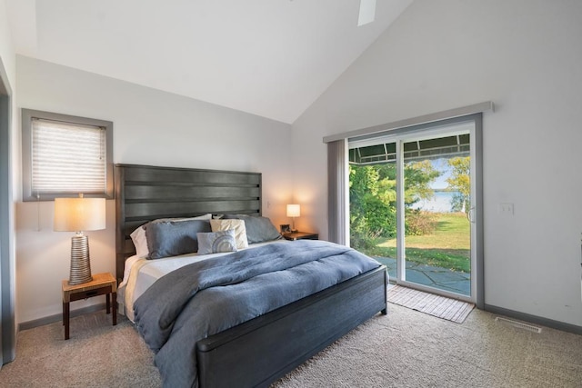 bedroom featuring access to exterior, high vaulted ceiling, and light colored carpet