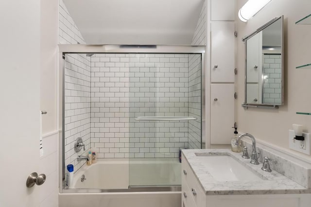 bathroom featuring vanity and enclosed tub / shower combo