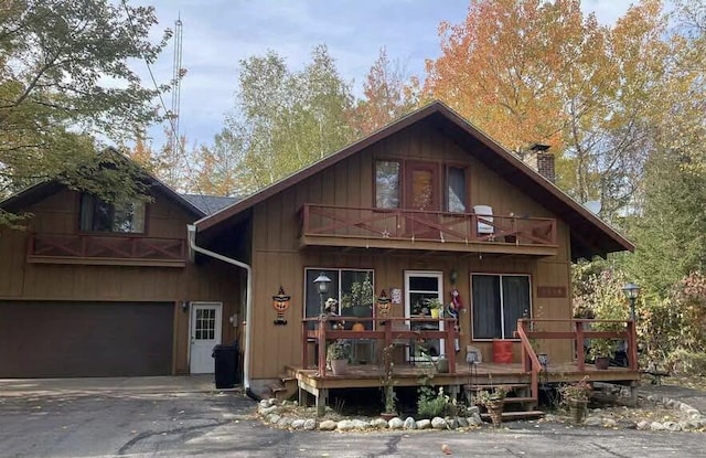 view of front of home featuring a balcony and a garage