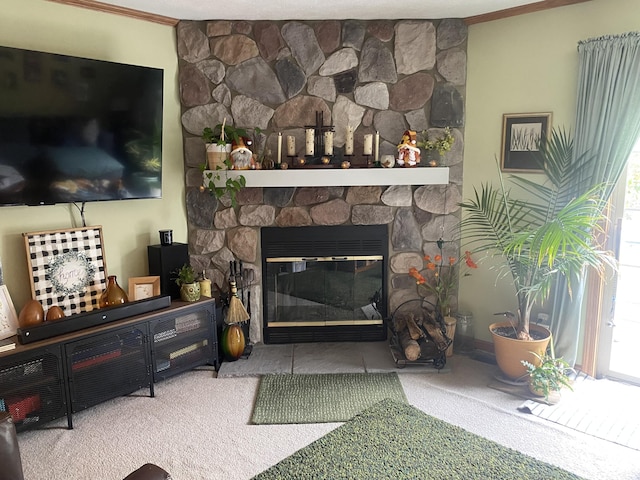 living room featuring carpet, a stone fireplace, and crown molding