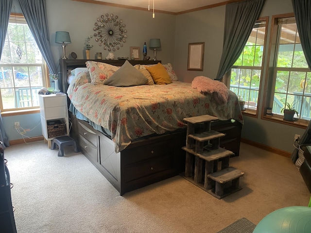 carpeted bedroom featuring ornamental molding