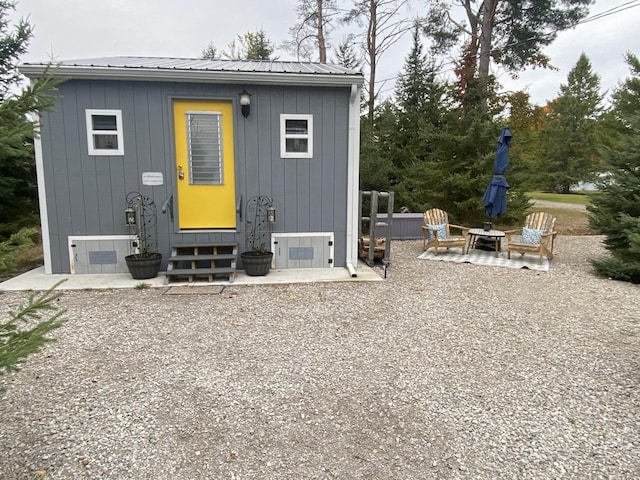 rear view of property featuring a patio