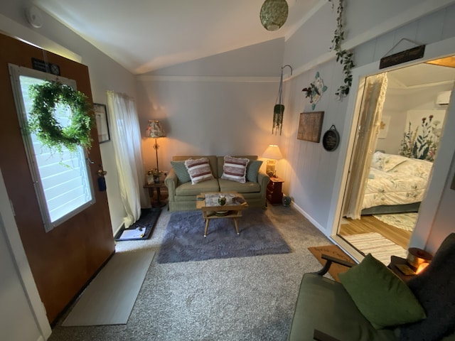 living room featuring carpet and lofted ceiling