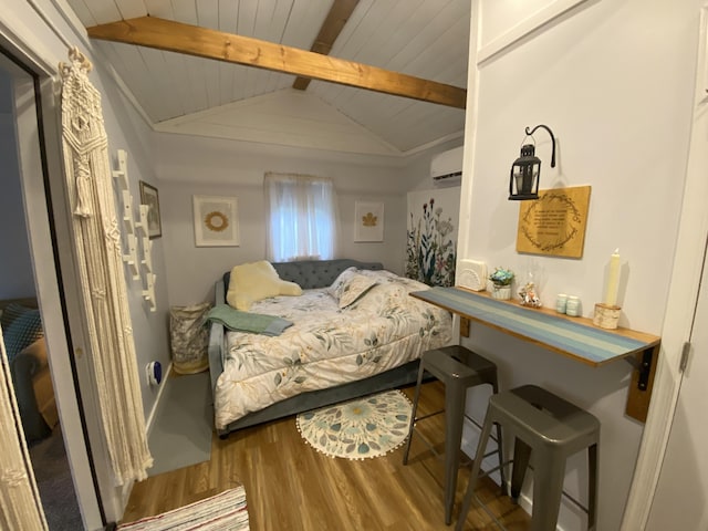 bedroom with a wall mounted air conditioner, hardwood / wood-style floors, lofted ceiling with beams, and wooden ceiling