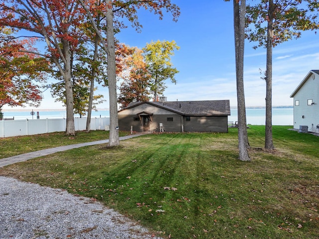 view of front of property with a water view and a front yard