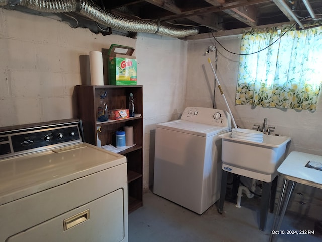 washroom featuring independent washer and dryer and sink