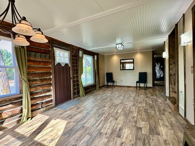 entrance foyer featuring ornamental molding, hardwood / wood-style flooring, and plenty of natural light