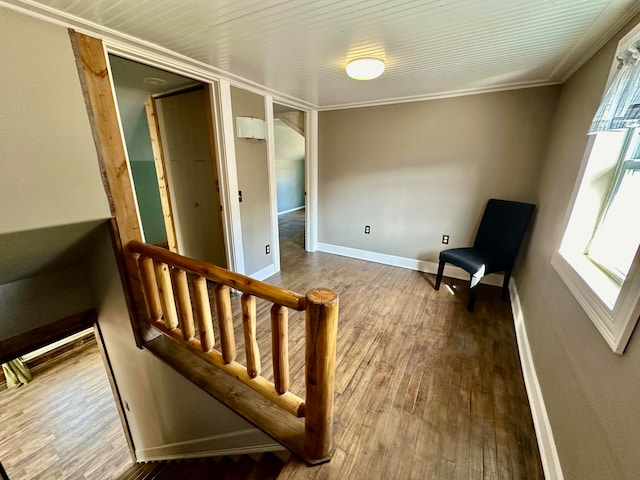 living area featuring ornamental molding and wood-type flooring