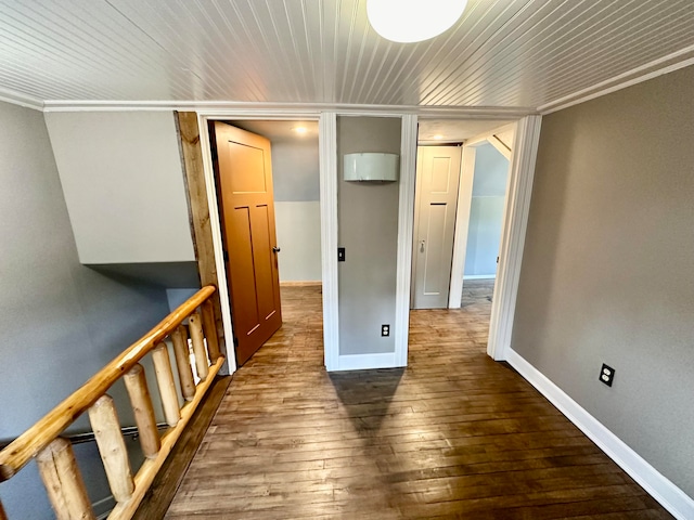 hall with crown molding, wooden ceiling, and dark hardwood / wood-style flooring