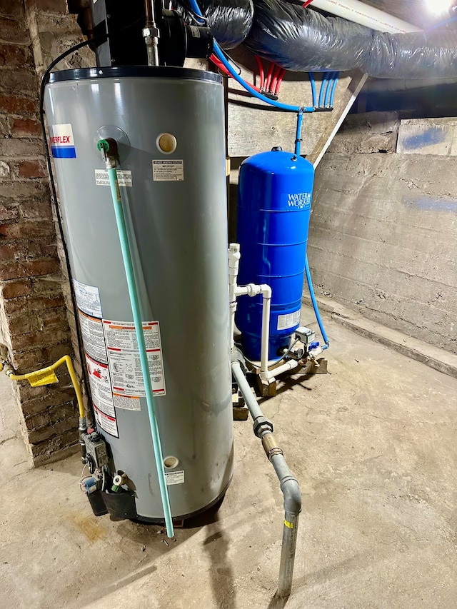 utility room with gas water heater