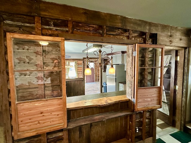 interior space featuring stainless steel fridge