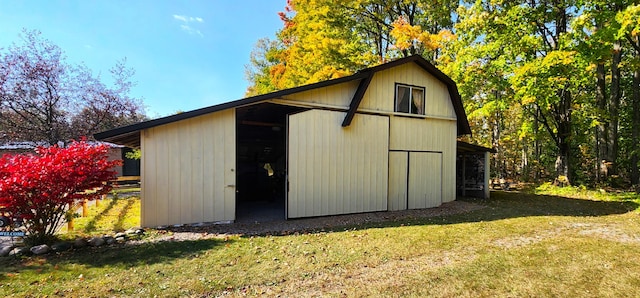 view of outbuilding with a lawn