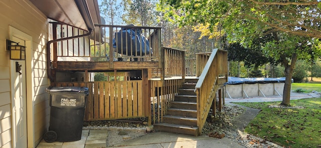 wooden terrace featuring a covered pool