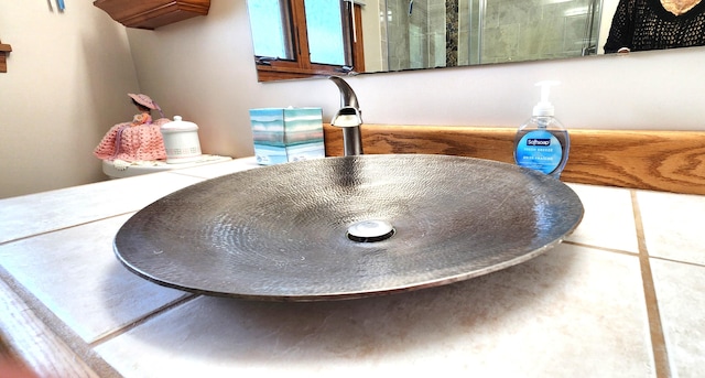 interior details with sink and tile patterned floors