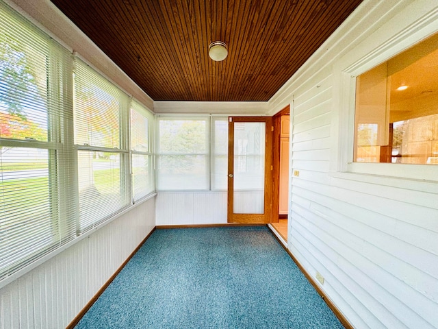 unfurnished sunroom featuring wooden ceiling