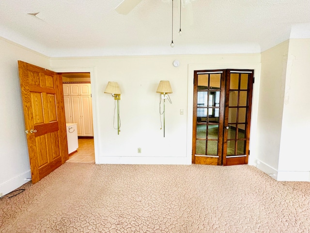 spare room with ceiling fan and a textured ceiling