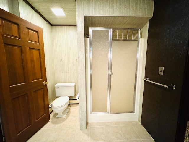 bathroom featuring tile patterned flooring, an enclosed shower, ornamental molding, toilet, and baseboard heating