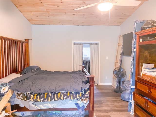 bedroom with wooden ceiling, hardwood / wood-style floors, and ceiling fan