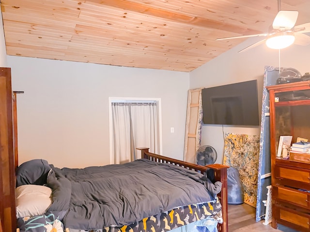 bedroom with ceiling fan, wood ceiling, and vaulted ceiling