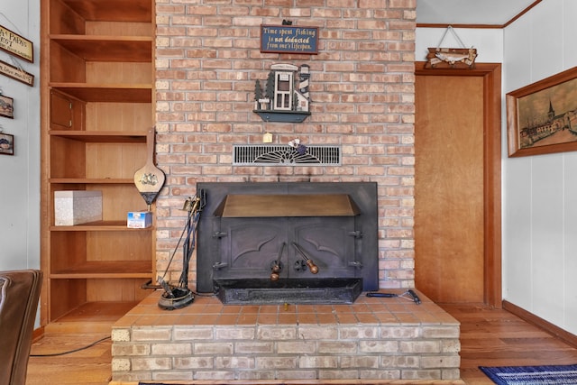 details featuring a fireplace and hardwood / wood-style flooring