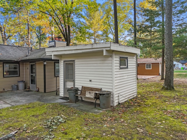 exterior space featuring an outbuilding and a patio area