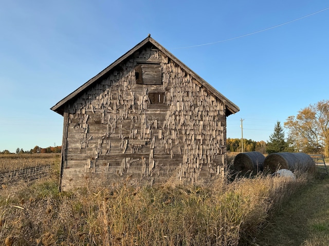 view of home's exterior featuring an outdoor structure