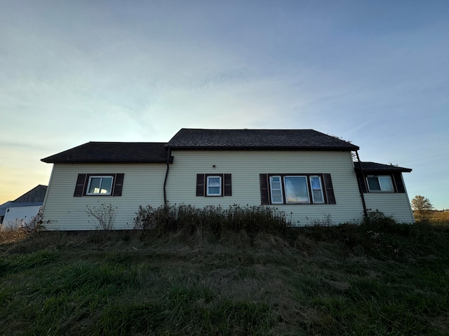 view of property exterior at dusk