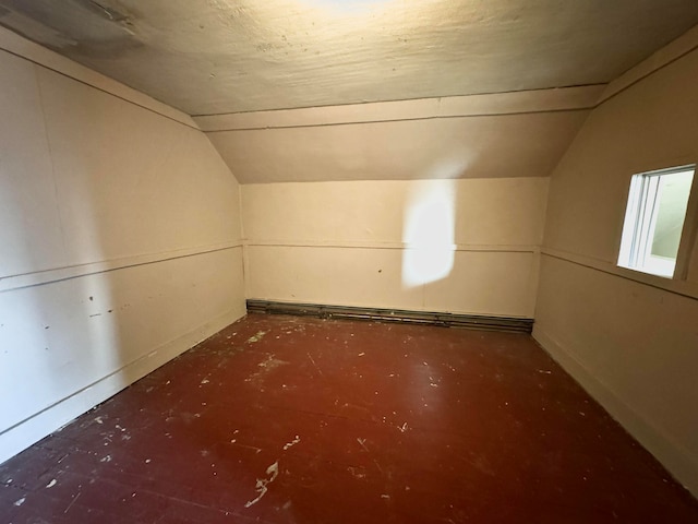 bonus room featuring vaulted ceiling