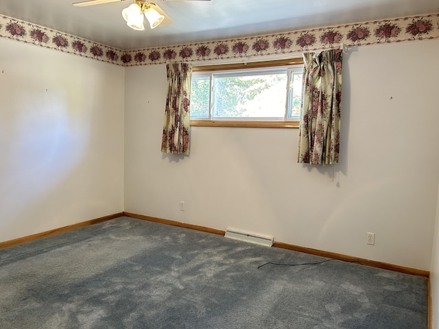 carpeted spare room with a baseboard radiator and ceiling fan