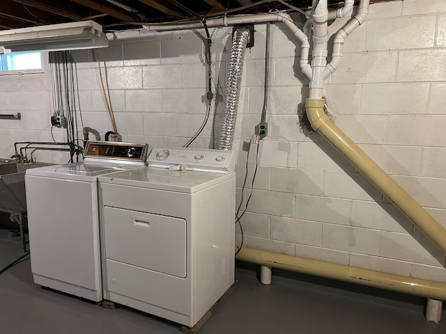 laundry room featuring separate washer and dryer