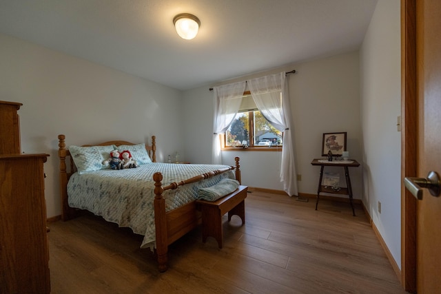 bedroom featuring wood-type flooring