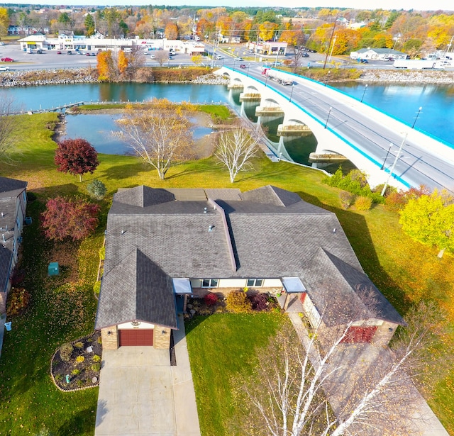 birds eye view of property featuring a water view