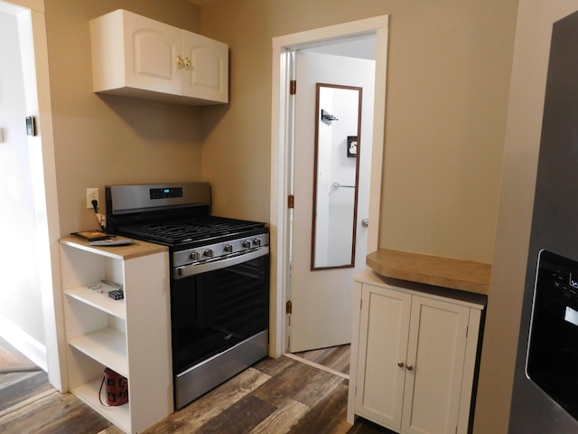 kitchen with white cabinets, stainless steel appliances, and dark wood-type flooring