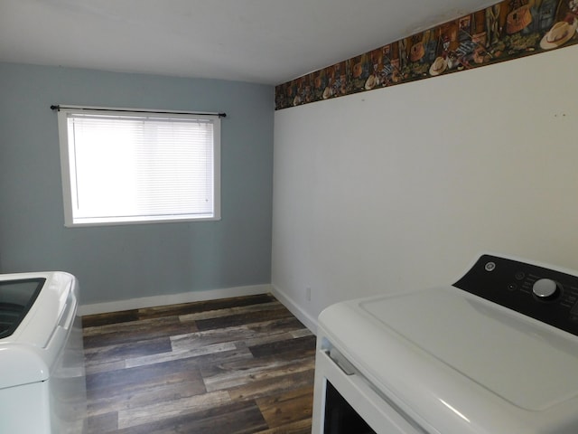 washroom with dark hardwood / wood-style flooring and washer and clothes dryer