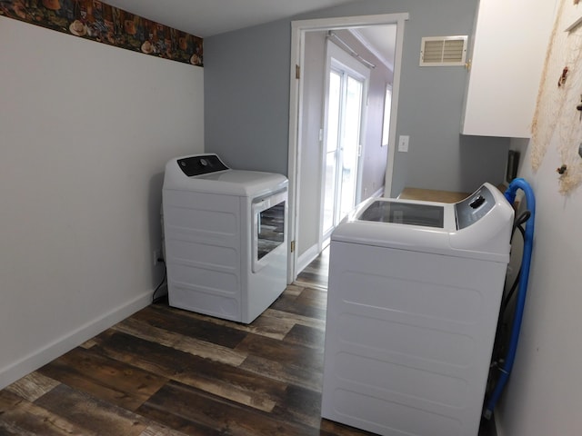 laundry room featuring washer and clothes dryer and dark wood-type flooring