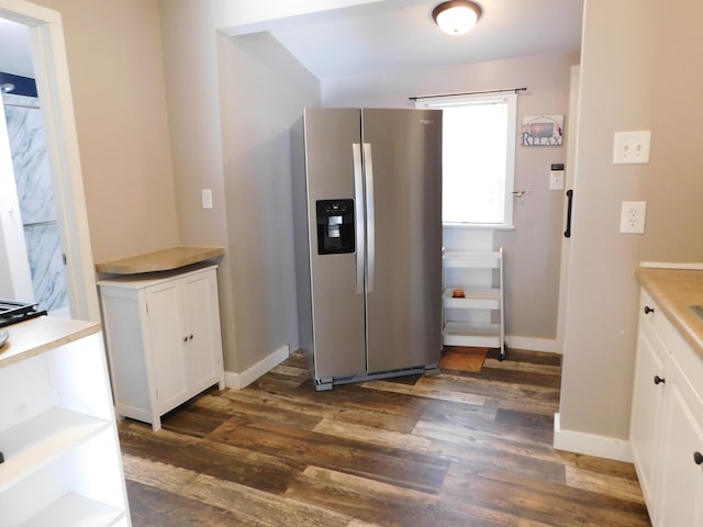 kitchen featuring white cabinetry, stainless steel fridge with ice dispenser, and dark hardwood / wood-style floors