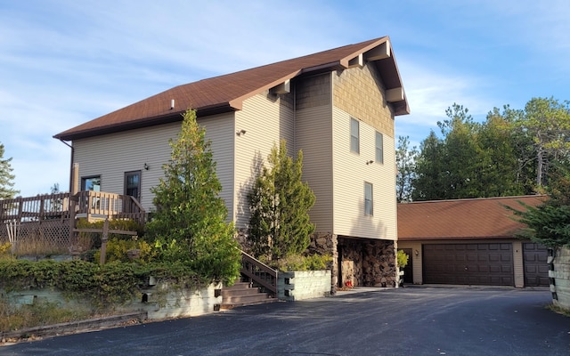 view of home's exterior featuring a wooden deck