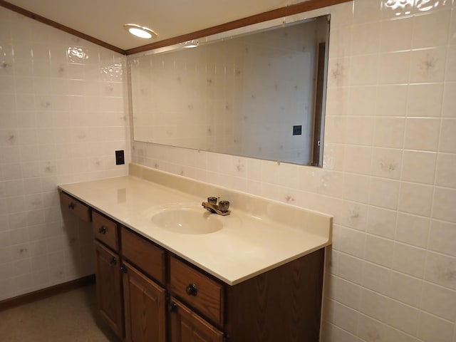 bathroom featuring vanity and tile walls