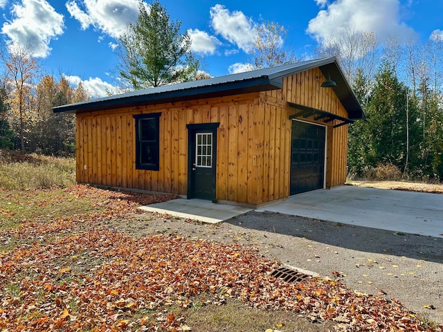 view of outbuilding featuring a garage