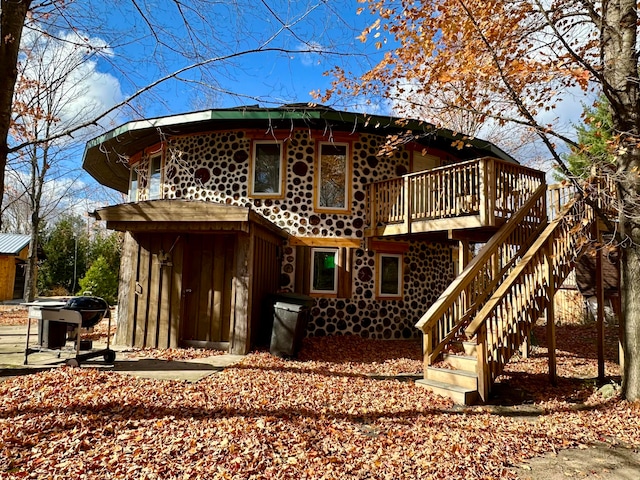 rear view of property with a deck