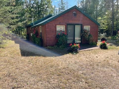 view of home's exterior featuring a yard