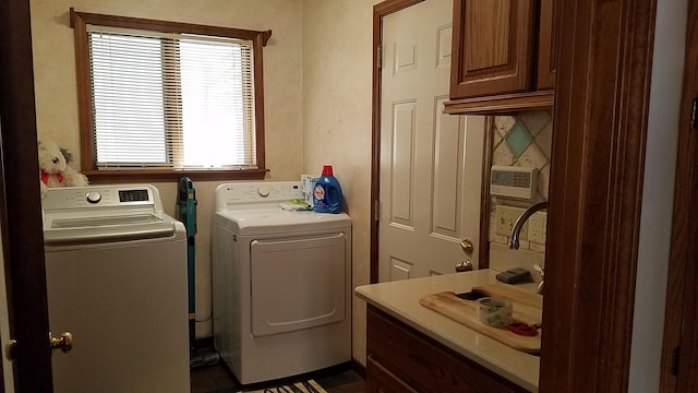 laundry area with cabinet space and independent washer and dryer