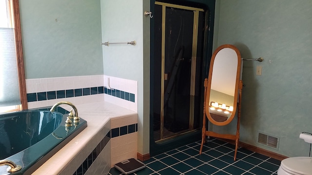 full bath featuring a stall shower, tile patterned flooring, visible vents, and toilet