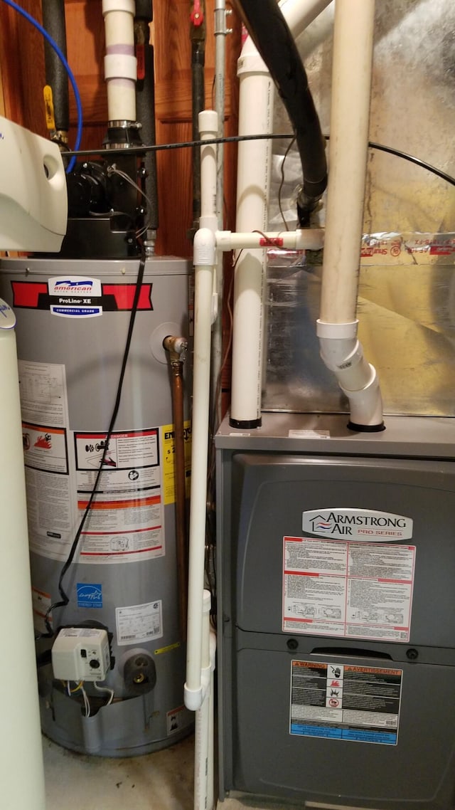 utility room featuring gas water heater